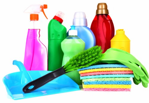 Domestic cleaning team working in a Soho apartment living room