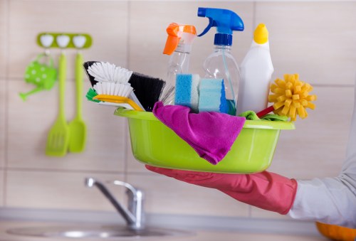 Staff member using PPE during a cleaning task