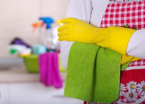 Cleaner preparing a compact Soho flat for move-out inspection